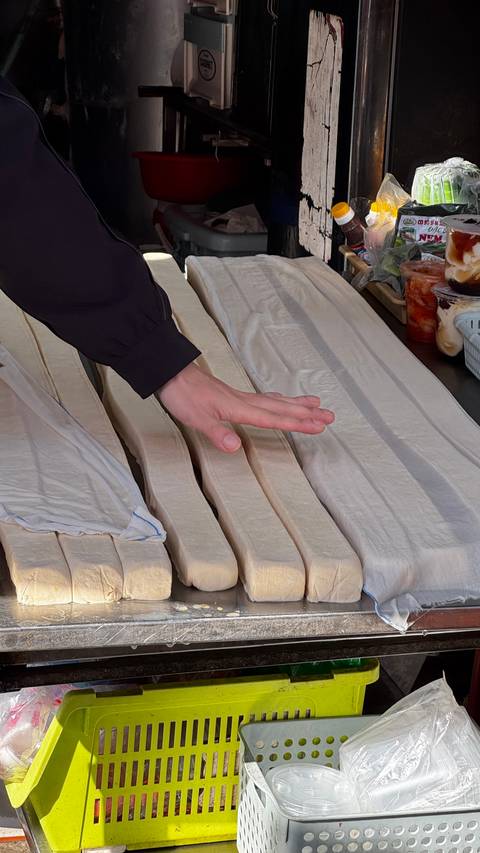 Close-up of fabrics being handled.