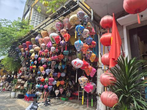       Shop with colorful lanterns hanging in Hoi An.
  