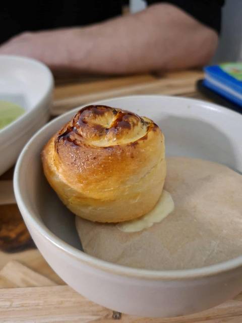       A dessert roll served in a bowl.
  
