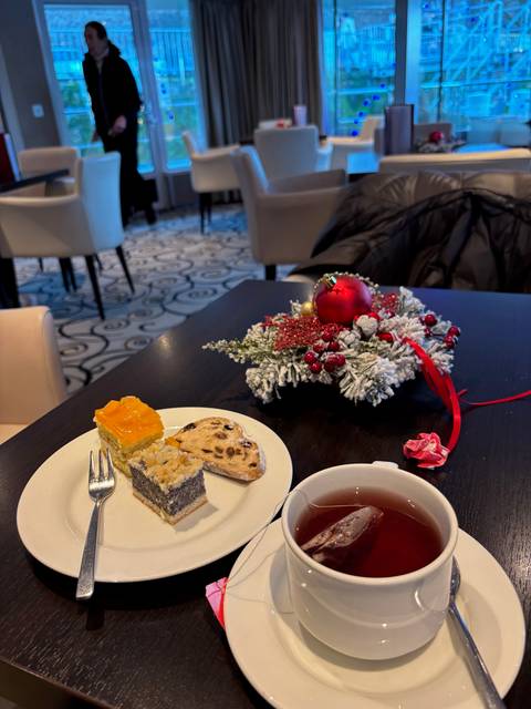 Close-up of desserts on a table with Christmas decorations.