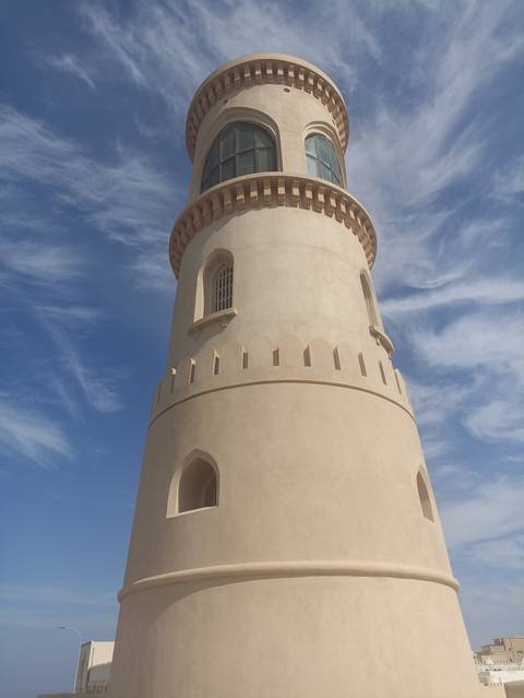 Historic watchtower with a clear blue sky.