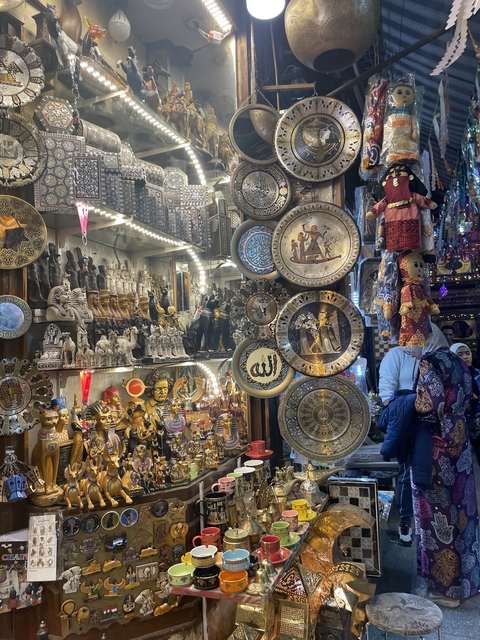       Market stall with various souvenirs and artifacts.
  