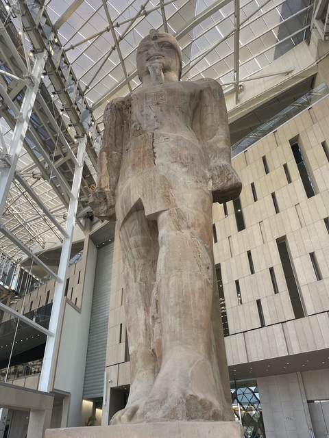       Gigantic statue inside a museum.
  