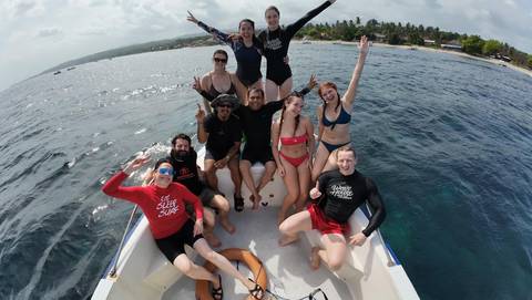 Group of people on a boat at sea.