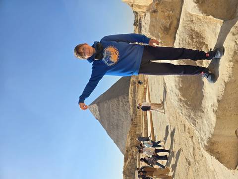 Boy posing with the Great Pyramid in the background.