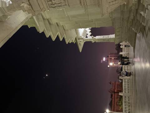       People in an architectural space during nighttime
  