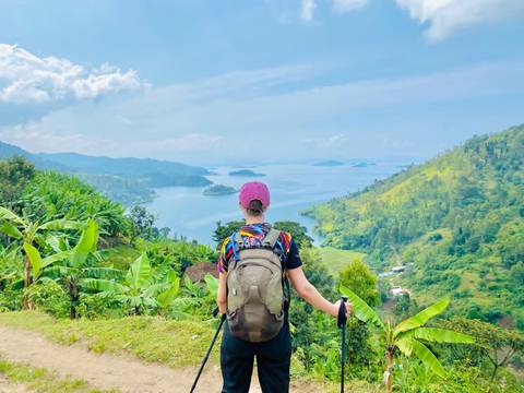 Person with a backpack overlooking a lake in Rwanda.