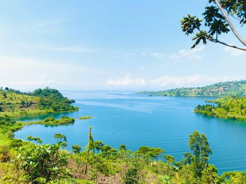 Scenic view of a lake surrounded by hills in Rwanda.