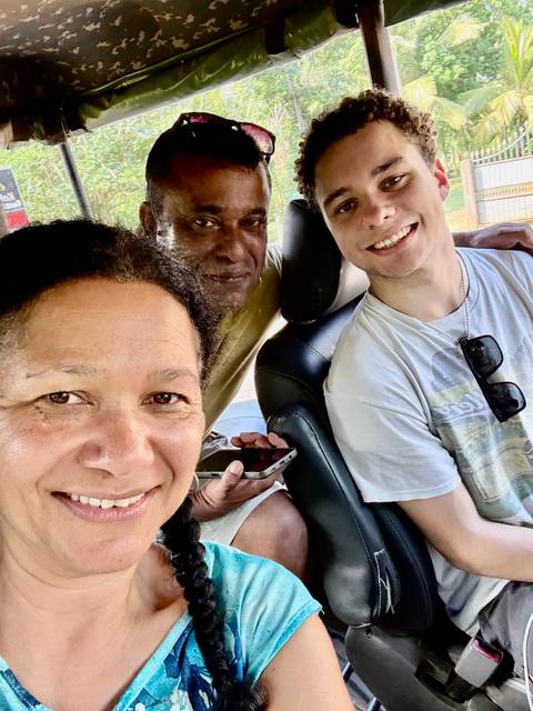 Group selfie in a car.