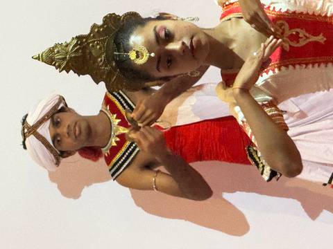       Traditional dancers performing in colorful attire.
  