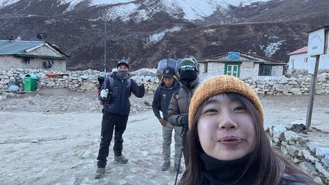 Group of people dressed warmly in a mountain village.