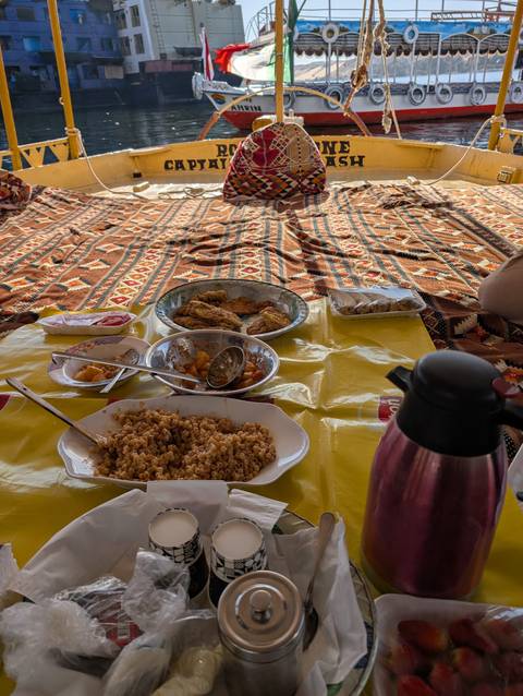 Casual outdoor dining setup with various dishes.