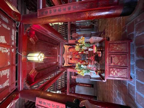      Interior of a temple with ornate wooden decorations
  