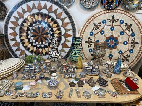 Display of intricate ceramic and mosaic artwork.