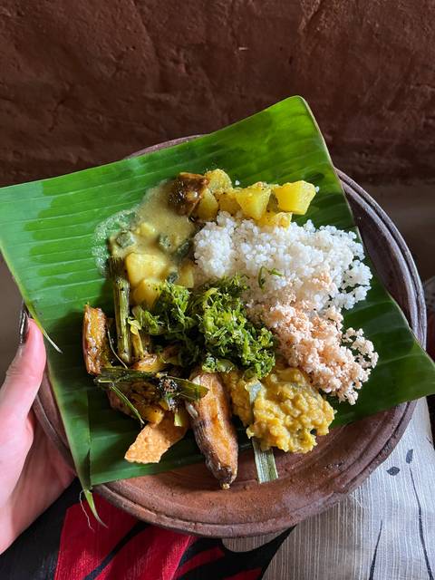 Traditional Sri Lankan meal served on a banana leaf.