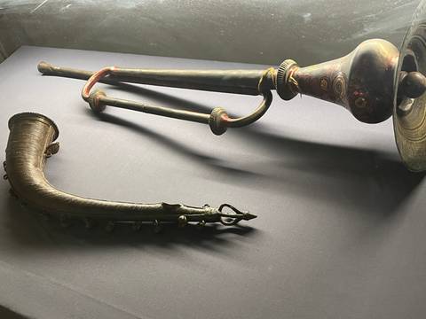       Antique musical instruments on display.
  