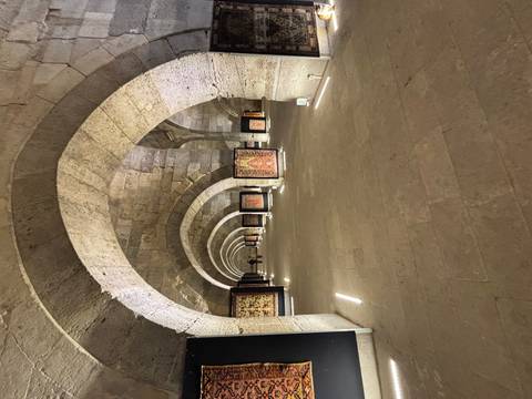 Interior view of a historical stone structure with arches.