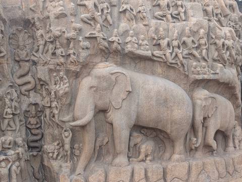       Stone carvings depicting elephants and various figures.
  