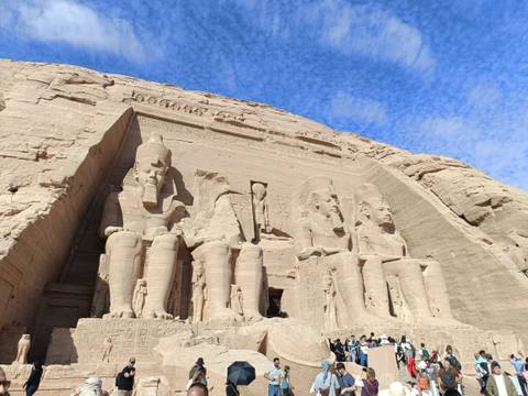       Abu Simbel temple entrance with blue sky.
  
