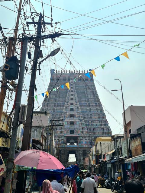 Ornate temple with colorful banner decorations.