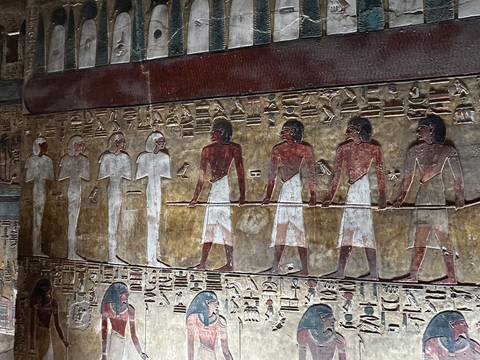       Wall frieze depicting ancient Egyptian figures
  