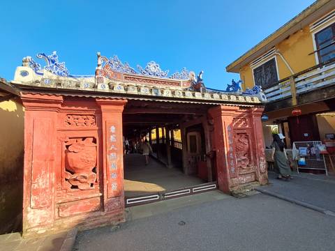 Decorative entrance painted in red with detailed artwork