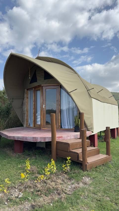      Small accommodation with a curved roof
  