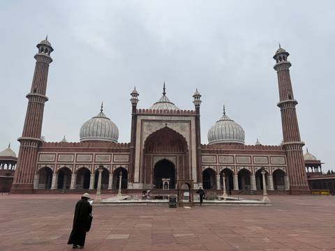 Jama Masjid, a large mosque with three domes and two minarets.