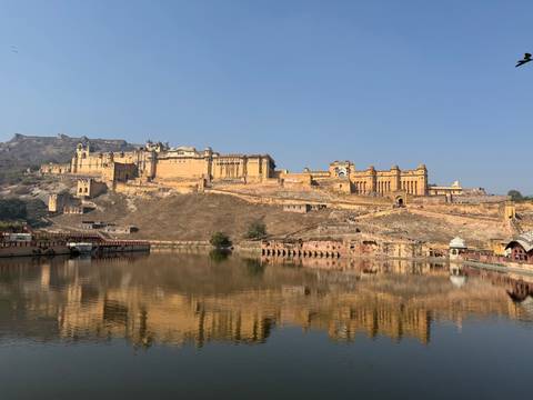 Expansive view of a fort with reflection in a water body.