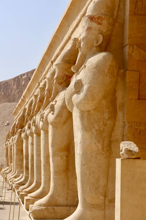 Ancient stone statues in an Egyptian temple.