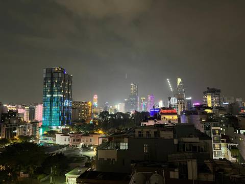 Night view of a brightly lit city skyline.