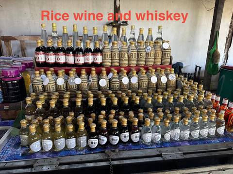 Display of colorful local beverages in bottles.