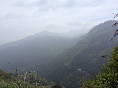 Misty mountain landscape with a view of valleys and peaks.