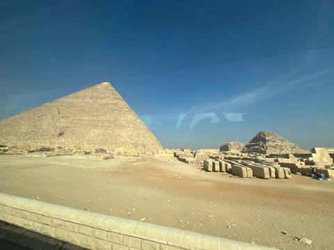 The Great Pyramid of Giza with a clear blue sky.
