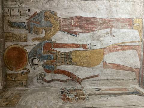       Colorful wall painting depicting Egyptian gods.
  