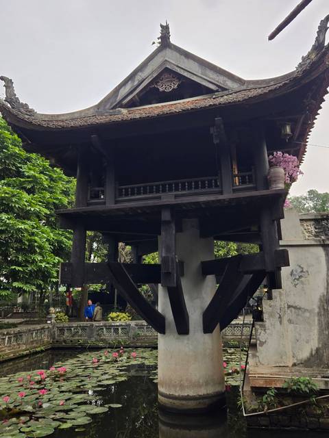       Traditional pagoda with ornate details and trees nearby.
  