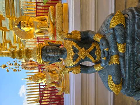 Buddhist statues with intricate golden details.