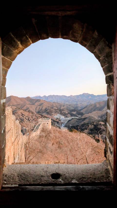       Great Wall and mountains at dusk.
  
