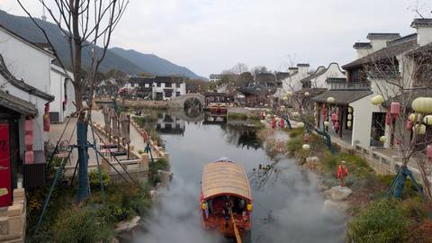 Boating on a canal in a traditional town.