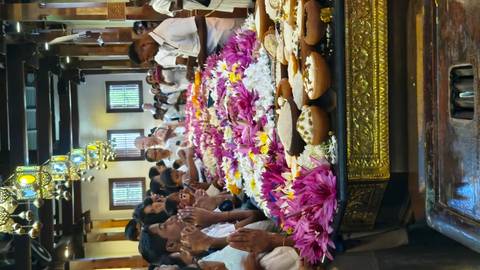 Group of people in a ritual with flowers.