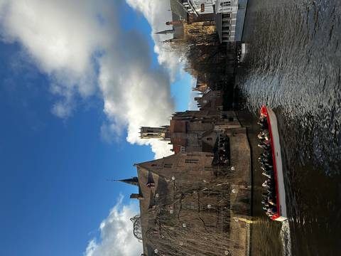 Canal with historic buildings and a boat.