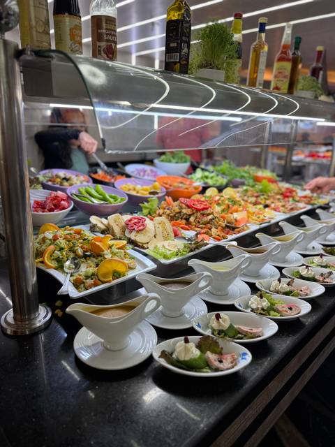 Buffet with various salads and dishes.