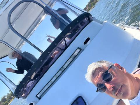 People on a boat posing for a photo.