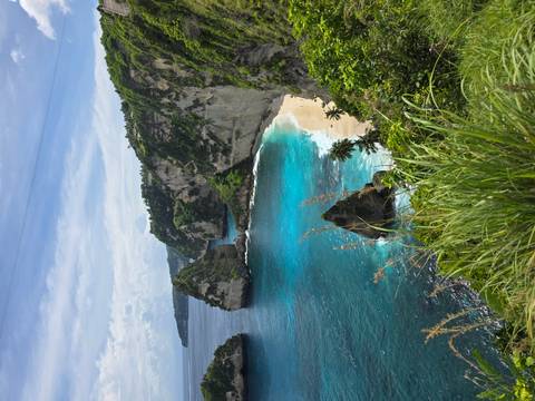 Stunning coastal view with cliffs and turquoise water.