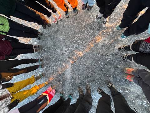 Group with spikes on icy ground.