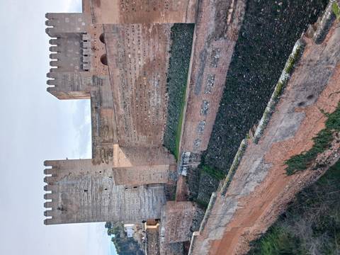 Section of an ancient fort with large stone walls and battlements.