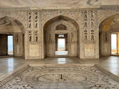 Intricately designed interior with decorated walls and archways.