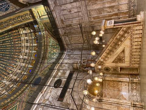 A grand, ornate interior of a historic mosque.