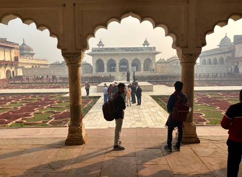 People exploring a historic site garden
