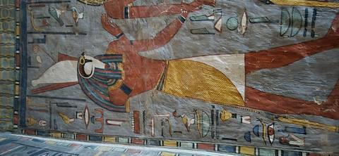       Close-up of ancient hieroglyphic artwork on a temple wall.
  